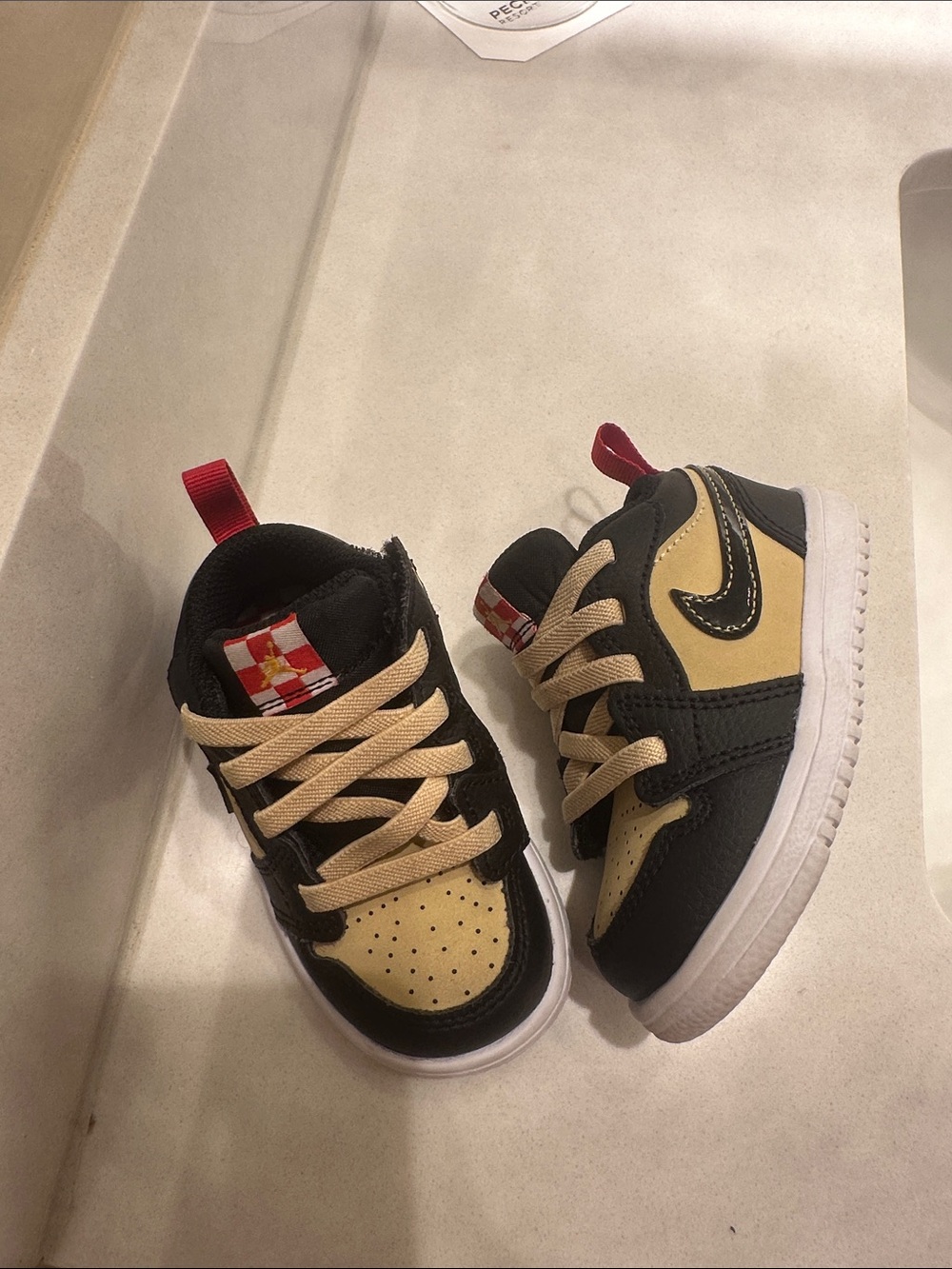 Jordan Kids Low-Top Sneakers in Black, Beige and Red Accents